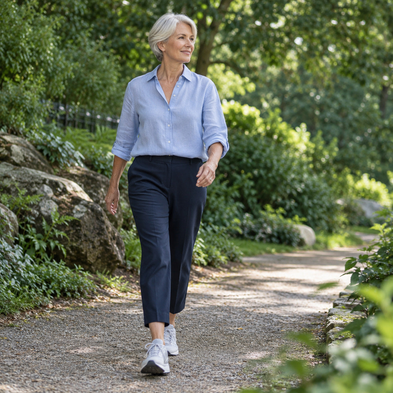 A woman walking confidently through a green park